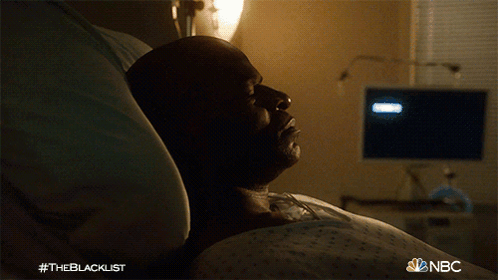 a man is laying in a hospital bed with the nbc logo on the bottom right