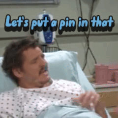 A Man Is Laying In A Hospital Bed With The Words Let 'S Put A Pin In That Above Him GIF