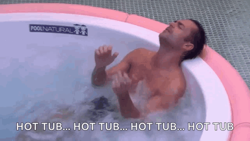 a man is laying in a hot tub with the words hot tub written on the bottom
