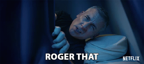 A Man Is Laying In Bed With The Words Roger That Written On The Bottom GIF