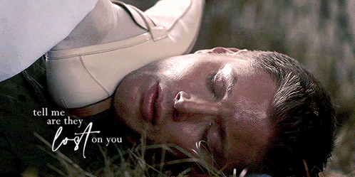 a man is laying in the grass with the words tell me are they lost on you