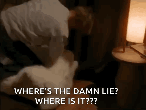 A Man Is Laying On A Bed With A Pillow And A Lamp And Says Where 'S The Damn Lie ? GIF
