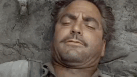 A Man Is Laying On A Bed With His Eyes Closed And The Words `` Good Morning '' Written Above Him . GIF