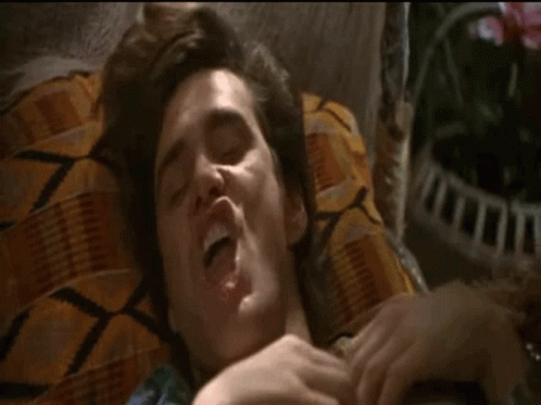 Man Lying On Bed With Mouth Open GIF
