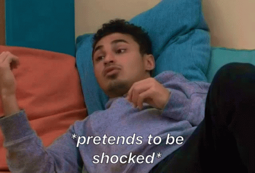 A Man Is Laying On A Couch With The Words Pretends To Be Shocked GIF