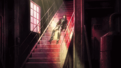 A Man Is Laying On A Set Of Stairs With A Sign That Says Danger GIF