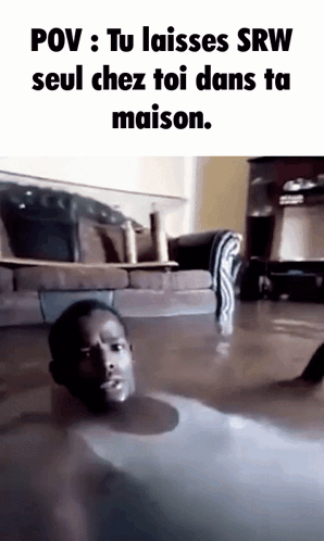 A Man Is Laying On The Floor In A Flooded Living Room GIF