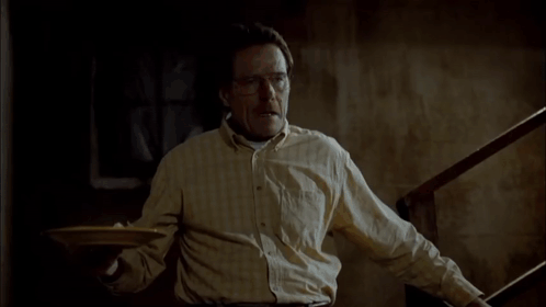 A Man Is Laying On The Floor With A Plate On The Floor GIF