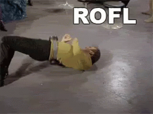 A Man Is Laying On The Floor With The Word Rofl Behind Him GIF