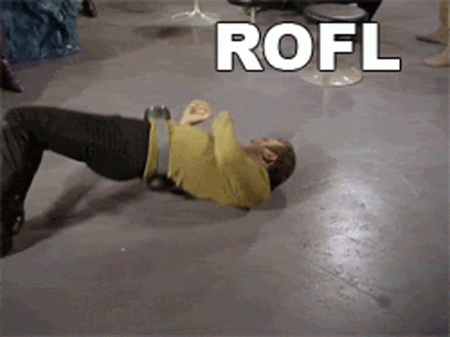A Man Is Laying On The Floor With The Word Rofl Written Above Him GIF