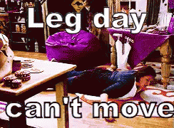 A Man Is Laying On The Floor With The Words Leg Day Can 'T Move Behind Him GIF