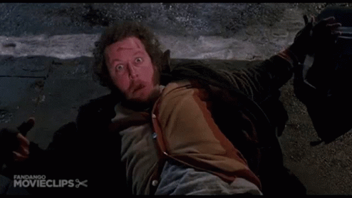 A Man Is Laying On The Ground With His Mouth Open In A Movie Clip GIF