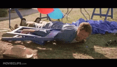 A Man Is Laying On The Ground With Movieclips.com Written On The Bottom Right GIF