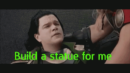 A Man Is Laying On The Ground With The Words Build A Statue For Me GIF