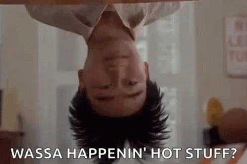 A Man Is Laying Upside Down On A Table With His Head Down And Says `` Wasa Happenin ' Hot Stuff '' . GIF