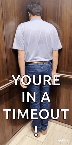 A Man Is Leaning Against A Wall In An Elevator With The Words " Youre In A Timeout " Below Him GIF