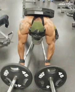 A Man Is Lifting A Barbell In A Gym With Plates That Say Dxp On Them GIF