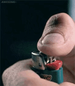 A Man Is Lighting A Bic Lighter With His Finger GIF