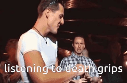A Man Is Listening To Death Grips While Holding A Glass GIF