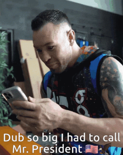 A Man Is Looking At A Cell Phone With The Words Dub So Big I Had To Call Mr. President GIF