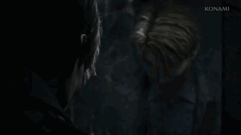 A Man Is Looking At Himself In A Mirror . GIF
