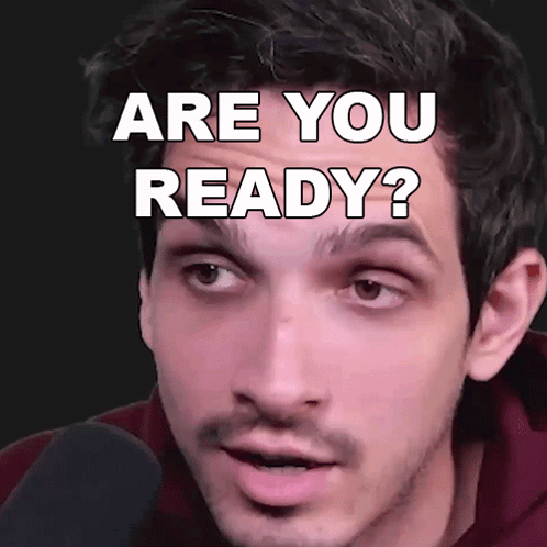 A Man Is Looking At The Camera With The Words " Are You Ready " On His Face GIF