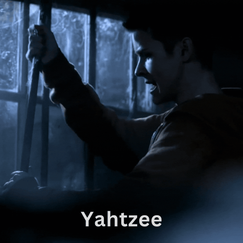 A Man Is Looking Out A Window And The Word Yahtzee Is On The Bottom GIF