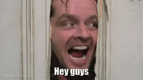 A Man Is Looking Through A Hole In A Wall With His Mouth Open And The Words `` Hey Guys '' Written On His Face . GIF