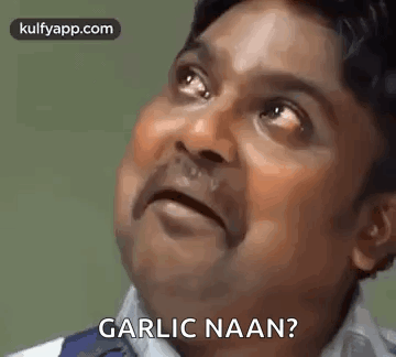 A Man Is Making A Funny Face And Asking Garlic Naan . GIF