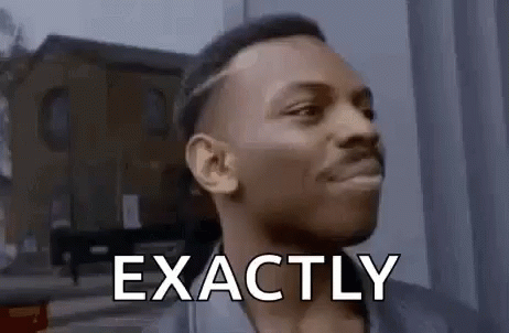A Man Is Making A Funny Face And Saying `` Exactly '' In Front Of A Building . GIF