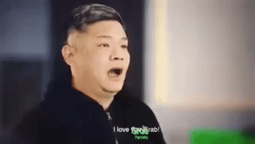 A Man Is Making A Funny Face And Saying `` I Love You Grab '' While Wearing A Black Jacket . GIF