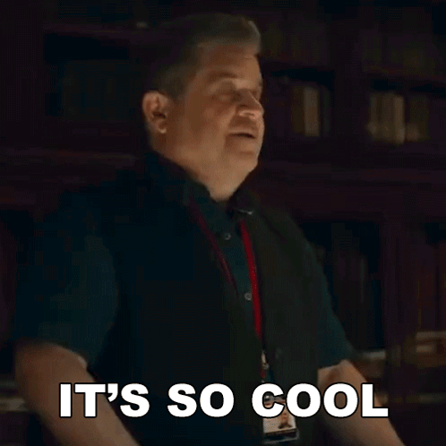 A Man Is Making A Funny Face And Saying `` It 'S So Cool '' With His Hands In The Air . GIF