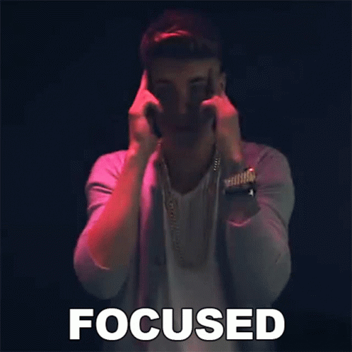 A Man Is Making A Funny Face And The Word Focused Is Above Him GIF