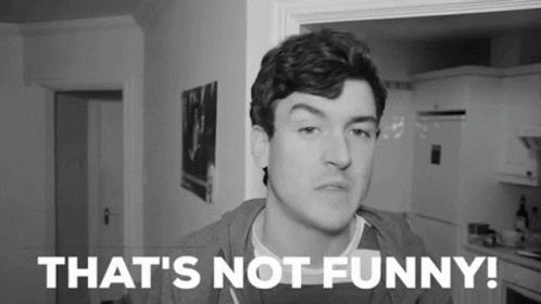 A Man Is Making A Funny Face In A Black And White Photo With The Words `` That 'S Not Funny ! '' GIF