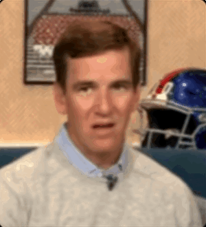 a man is making a funny face in front of a football helmet and a picture of a football field .