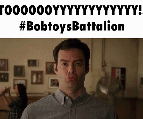 Man Making Funny Face In Front Of Bobtoys Battalion Sign GIF