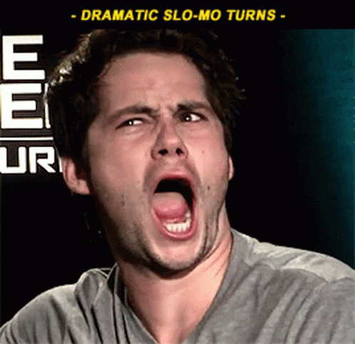 A Man Is Making A Funny Face In Front Of A Sign That Says Ee Ur GIF