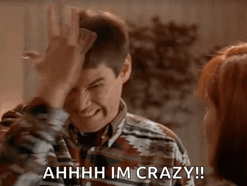 A Man Is Making A Funny Face While Holding A Piece Of Paper In His Hand . GIF