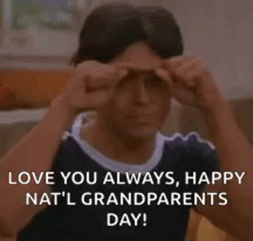 A Man Is Making A Funny Face While Holding His Hands To His Eyes . GIF