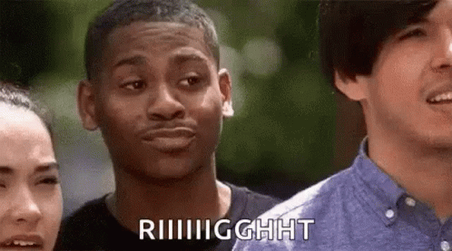 A Man Is Making A Funny Face While Standing Next To A Woman And Another Man . GIF