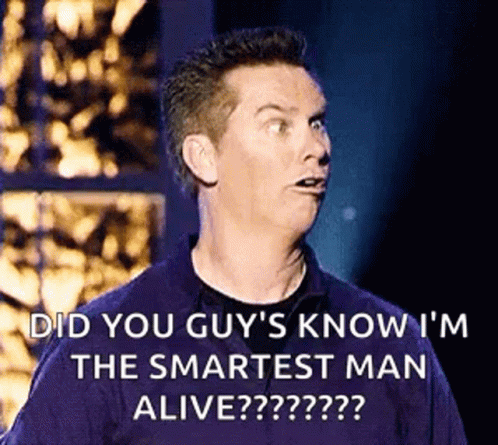A Man Is Making A Funny Face While Standing On A Stage . GIF