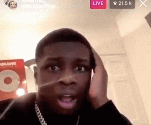 A Man Is Making A Funny Face While Talking On A Phone . GIF