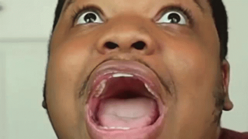 A Man Is Making A Funny Face With His Mouth Open And His Tongue Out . GIF