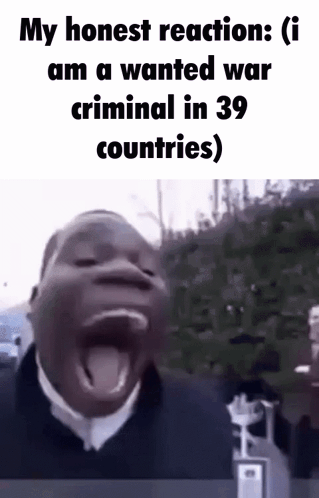 A Man Is Making A Funny Face With His Mouth Open And His Tongue Sticking Out . GIF