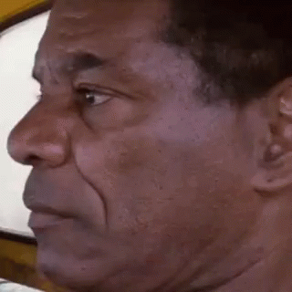 A Man Is Making A Funny Face With His Mouth Open . GIF
