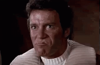A Man Is Making A Funny Face With His Mouth Open . GIF