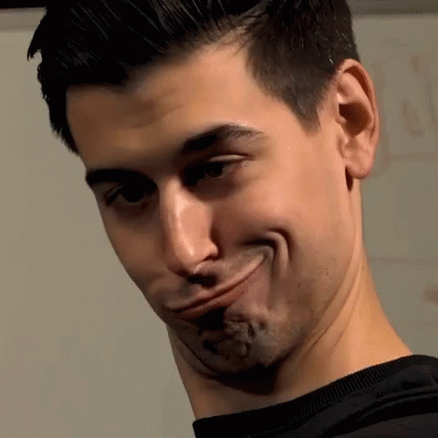 A Man Is Making A Funny Face With His Mouth Wide Open GIF