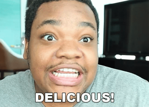 A Man Is Making A Funny Face With The Word Delicious Written On His Face GIF