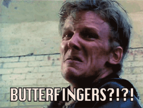 A Man Is Making A Funny Face With The Words Butterfingers Written Above Him GIF