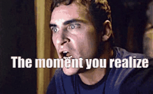 A Man Is Making A Funny Face With The Words The Moment You Realize Above Him GIF